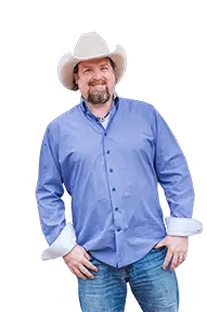 A man wearing a cowboy hat and jeans.