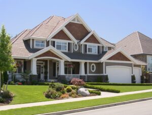A house with a large front yard and landscaping.